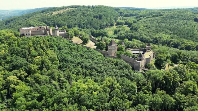 Aerial drone view of the landmark of Helfstyn Castle. Helftyn Castle overlooking the hills where the castle lies during a beautiful sunny day. Located in Czech republic