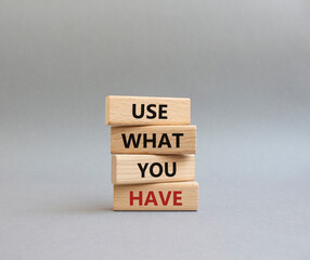 Use what you Have symbol. Concept words Use what you Have on wooden blocks. Beautiful grey background. Business and Use what you Have concept. Copy space.