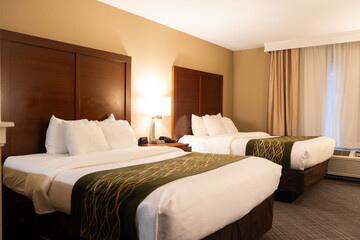 Fototapeta na wymiar Standard hotel bedroom with two queen size beds