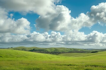 Fluffy white clouds casting soft shadows over rolling hills