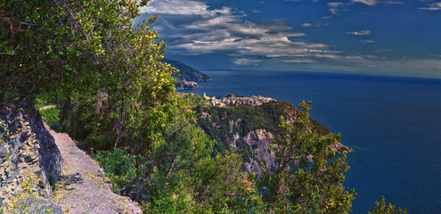 Fototapeta na wymiar Cinque Terre views of hiking trail along seaside villages on the Italian Riviera coastline. Liguria, Italy, Europe. 2023 Summer. 