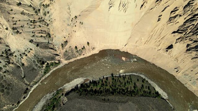 Aerial bird's eye view of Farwell Canyon and the chilcotin river on a sunny day