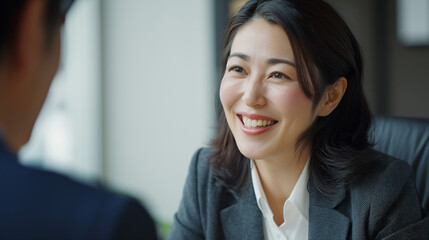 Japanese Businesswoman in Job Interview: Candid Meeting, Recruitment Talk, Manager and Candidate Discussion, Happy HR Management Interaction, Middle Aged Professional Negotiation, Business People Enga - obrazy, fototapety, plakaty