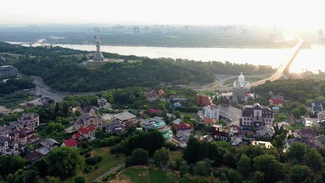 Paton bridge over the river Dnieper, Motherland monument in Kiev, Ukraine. Aerial panoramic view from drone.