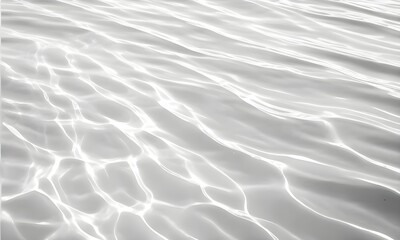 Obraz premium Closeup of desaturated transparent clear calm water surface texture with ripples and spots. Pure natural swirl pattern texture. Sea world in sunlight, copy space, top view. 