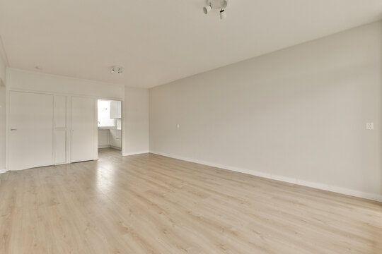 Spacious empty interior with hardwood floors