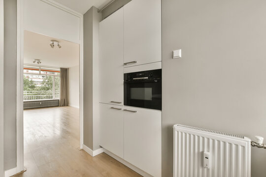 Modern kitchen opening to a bright living space