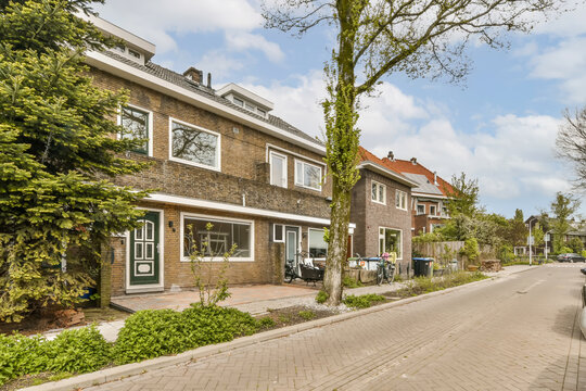 a brick house with a street in front of it
