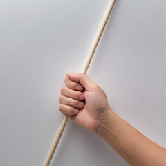 Wooden stick in a hand