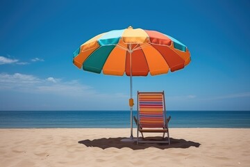 Beach umbrella with sunbed. A colorful beach chair under a large striped umbrella on beach. Summer vacation at sea. White sand and sea.