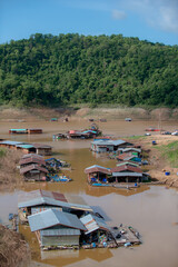 
fishing village with a house on the surface of the water.
