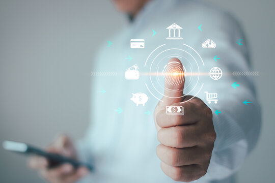 Businessman use digital processing of biometric identification fingerprint scanner for access personal financial data. E-kyc, cyber security, innovation technology identity, privacy id protection.