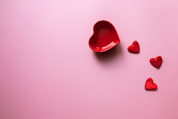 Valentine's Day background. Blank Heart-Shaped Candy or Sauce Plate on Pink Background