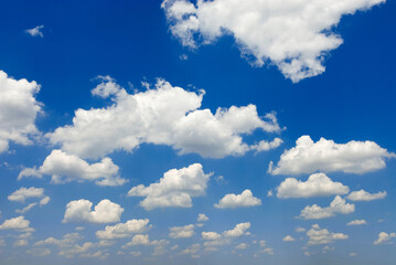 Naklejka na ściany i meble blue sky and white cumulus humilis fair weather clouds, near Matera, Italy, Europe