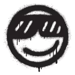  graffiti smiling face icon with sunglasses sprayed in black over white © tedi