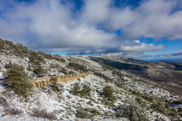Fototapeta na wymiar Guadarrama National Park (Parque Nacional de Guadarrama): Snow-capped Guadarrama Mountains (Sierra de Guadarrama) is a mountain range forming not far from Madrid in January 2024. MADRID, SPAIN.
