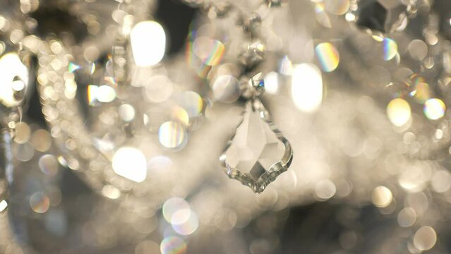 The crystal chandelier glows and shines