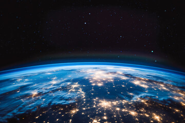 Planet earth from space with lights visible. Vision of sunrise over the earth visible from space. city lights visible on the continents. - obrazy, fototapety, plakaty