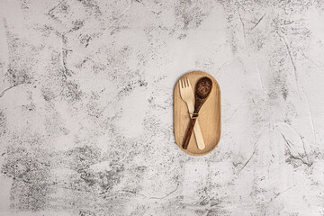A wooden plate and cutlery of the same material