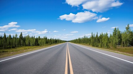 Fototapeta premium highway in the grassland background of blue sky and bright clouds, long road stretches into the distance. empty street on a beautiful sunny day