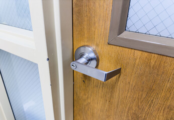 door handle close-up, portraying sophistication and access, inviting the viewer into a world of...