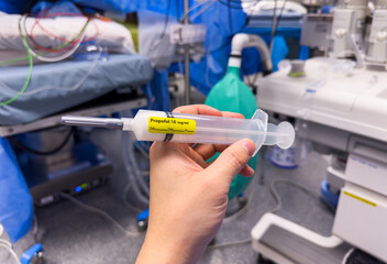 Medical vials, syringes, and needles representing hospital drugs and medications for anesthesia and sedation in healthcare settings