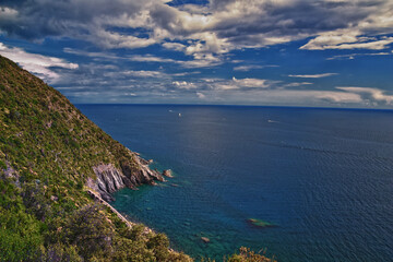 Fototapeta premium Cinque Terre Mediterranean Sea views along town hiking trail Italian Riviera coastline. Liguria, Italy, Europe. 2023 Summer. 