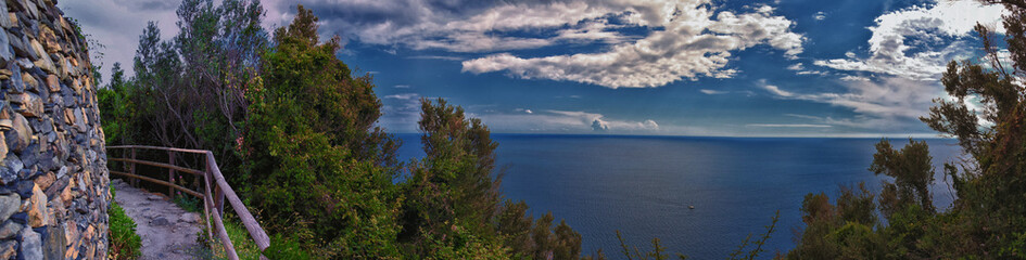 Fototapeta na wymiar Cinque Terre Mediterranean Sea views along town hiking trail Italian Riviera coastline. Liguria, Italy, Europe. 2023 Summer. 