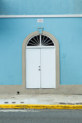 Traditional White Double Doors with Blue Wall Facade San Juan, Puerto Rico