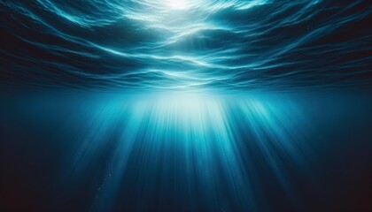 Fototapeta premium Underwater view of blue ocean wave with sunbeams 