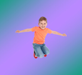 Fototapeta na wymiar Happy boy jumping on color gradient background