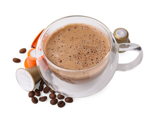 Cup of coffee, capsules and beans isolated on white