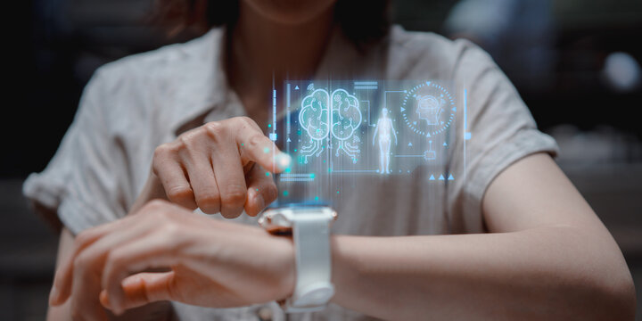Smartwatch health check with digital system on modern virtual screen. Wristwatch brain monitor checking for tracking health condition. Healthcare, Medical technology and futuristic concept. - Powered by Adobe