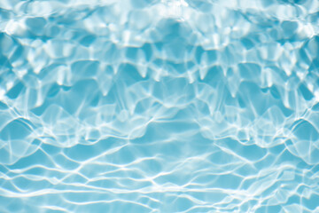Bluewater waves on the surface ripples blurred. Defocus blurred transparent blue colored clear calm water surface texture with splash and bubbles. Water waves with shining pattern texture background.