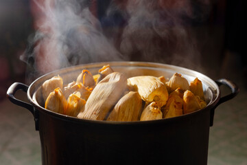 Hot corn tamales in a tamale steamer. Traditional mexican food	