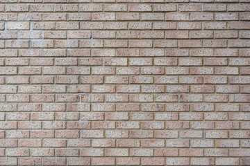 Modern beige brick wall  background texture. Home and office interior design backdrop.