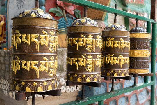 Prayer wheels is spun by devotees to aid for meditation and accumulating wisdom, good karma and putting negative energy aside