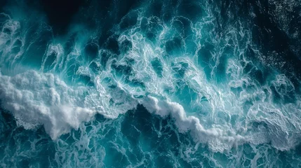 Gordijnen beautiful photo of blue water flowing in waves with white foam in a ocean. taken from up top above perspective. wallpaper background 16:9 © SayLi