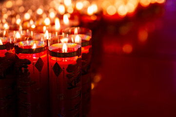 Selective focus at candle's flame (word mean may all your wish comes true ) that light up for...