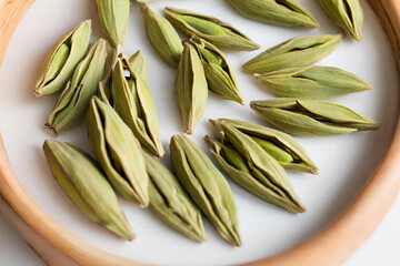 Green cardamom pods with unique triangular shape and aromatic seeds