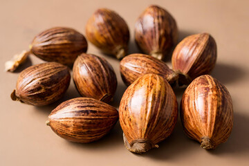Whole nutmegs arranged with their mottled brown shells, showcasing their distinctive shape and rich aroma