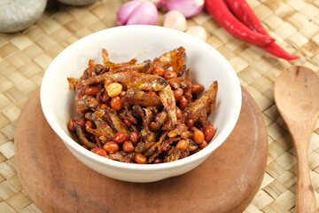 Fototapeta premium Sambal balado teri kacang is fried anchovy and peanuts with hot and spicy chili sauce.Traditional Indonesian food