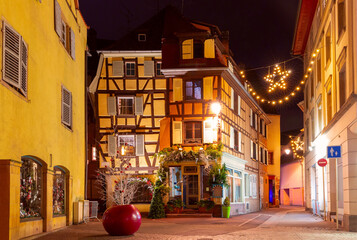 Fototapeta na wymiar Old town of Colmar, decorated and illuminated at Christmas time, Alsace, France