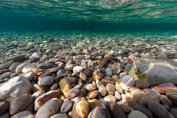pebbles beach rocks colour depth stone underwater uw river sand minorca balear island spain...