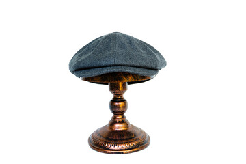 Concept photo catalog of classic newsboy cap with eight panels made of wool and warm dark grey...