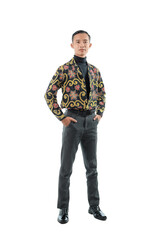 A portrait of Asian man wearing batik shirt is smiling isolated by white background