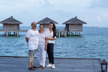 Picture of an Indian family enjoying vacation in Maldives