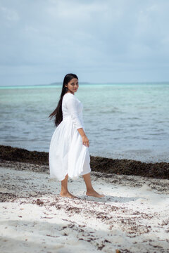 Picture of an Indian model in white dress in the beaches of Maldives