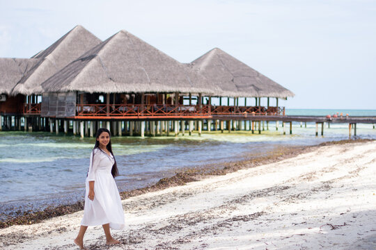 Picture of an Indian model in white dress in the beaches of Maldives