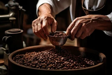Zelfklevend Fotobehang Hands of a barista scooping roasted coffee beans, showcasing aroma and quality. © AdriFerrer
